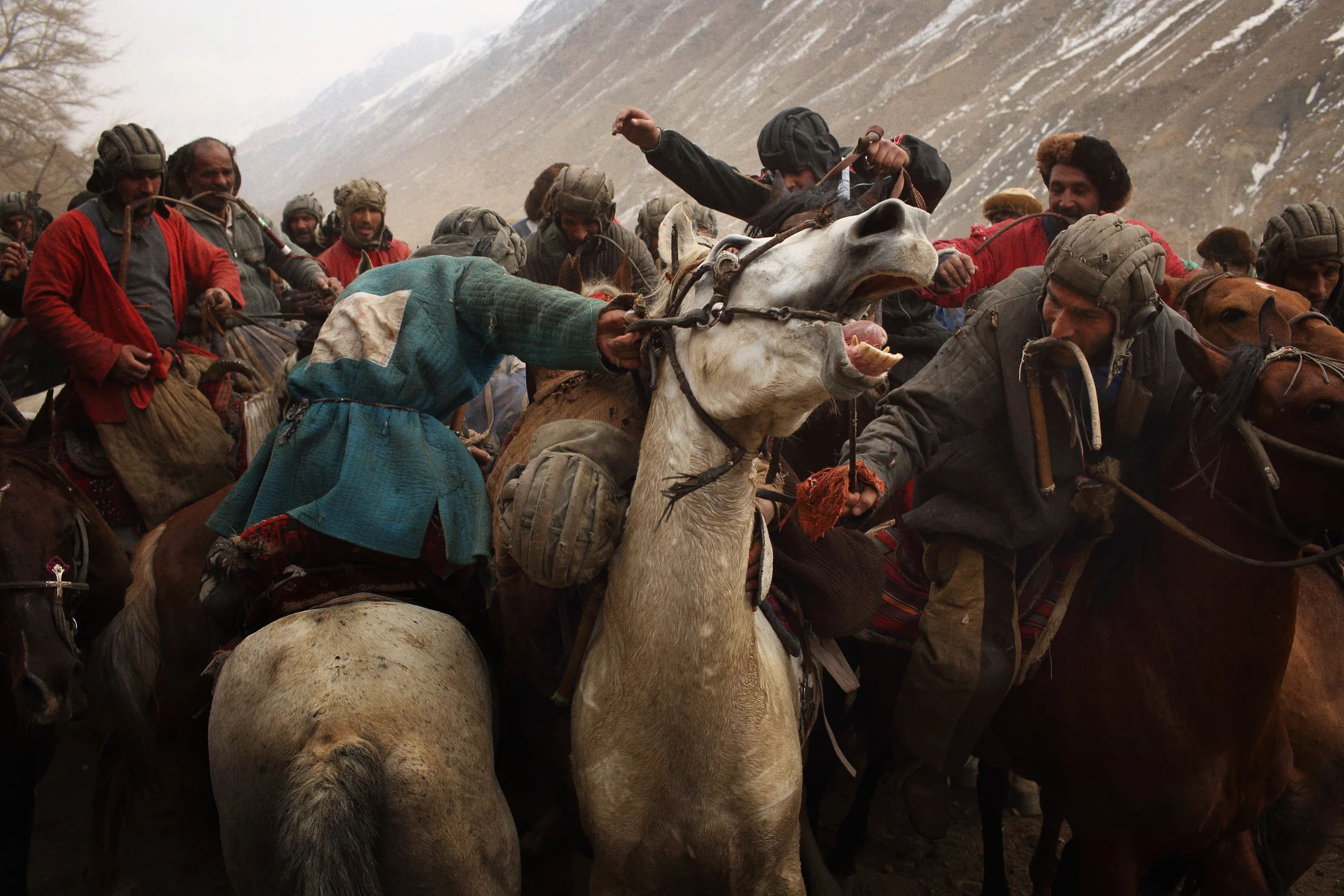  Horsemen, ‘chapandaz’, vie for the carcass of a dead calf in Afghanistan’s national sport, Buzkashi. Panjshir Province, January 2014. 