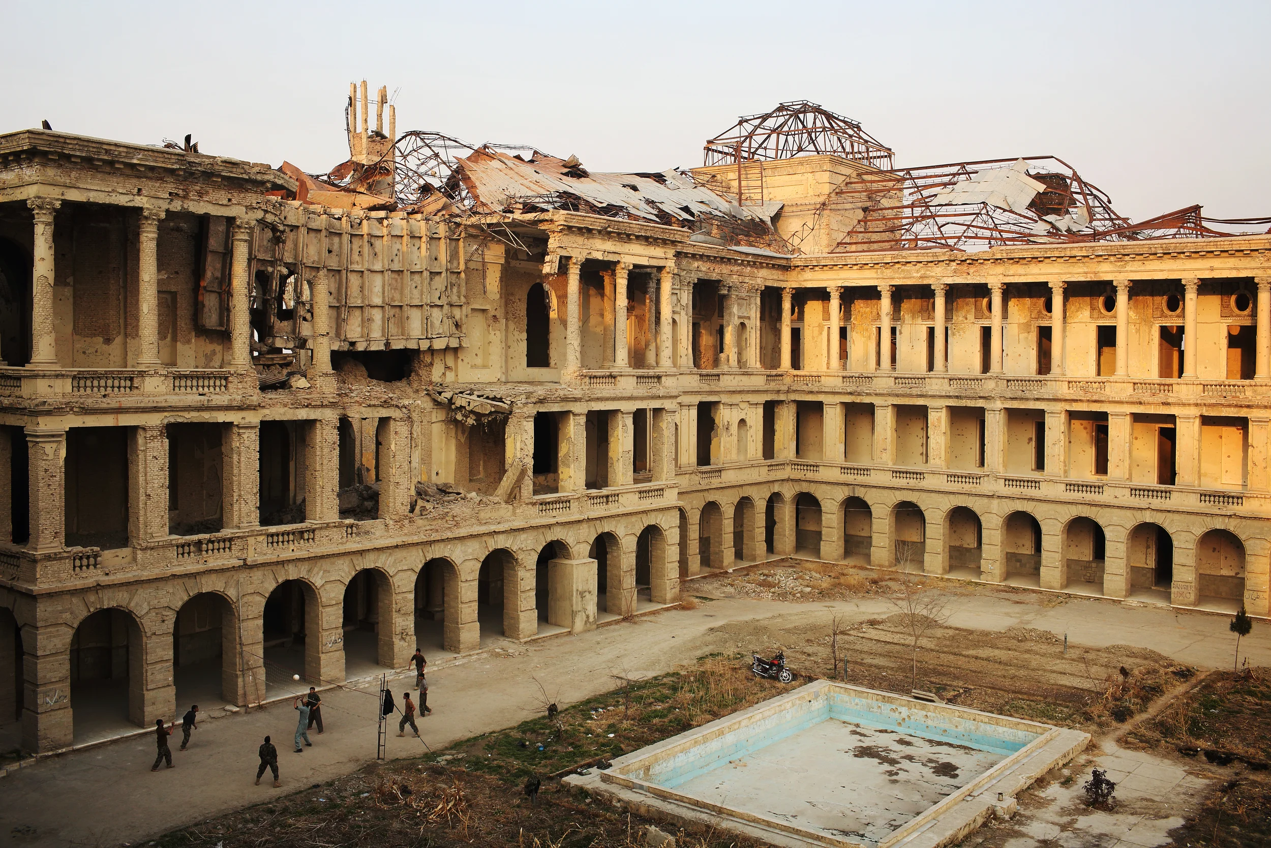  Police play volleyball in the century-old Darulaman Palace which still shows the scars of the civil war of the 1990s.  