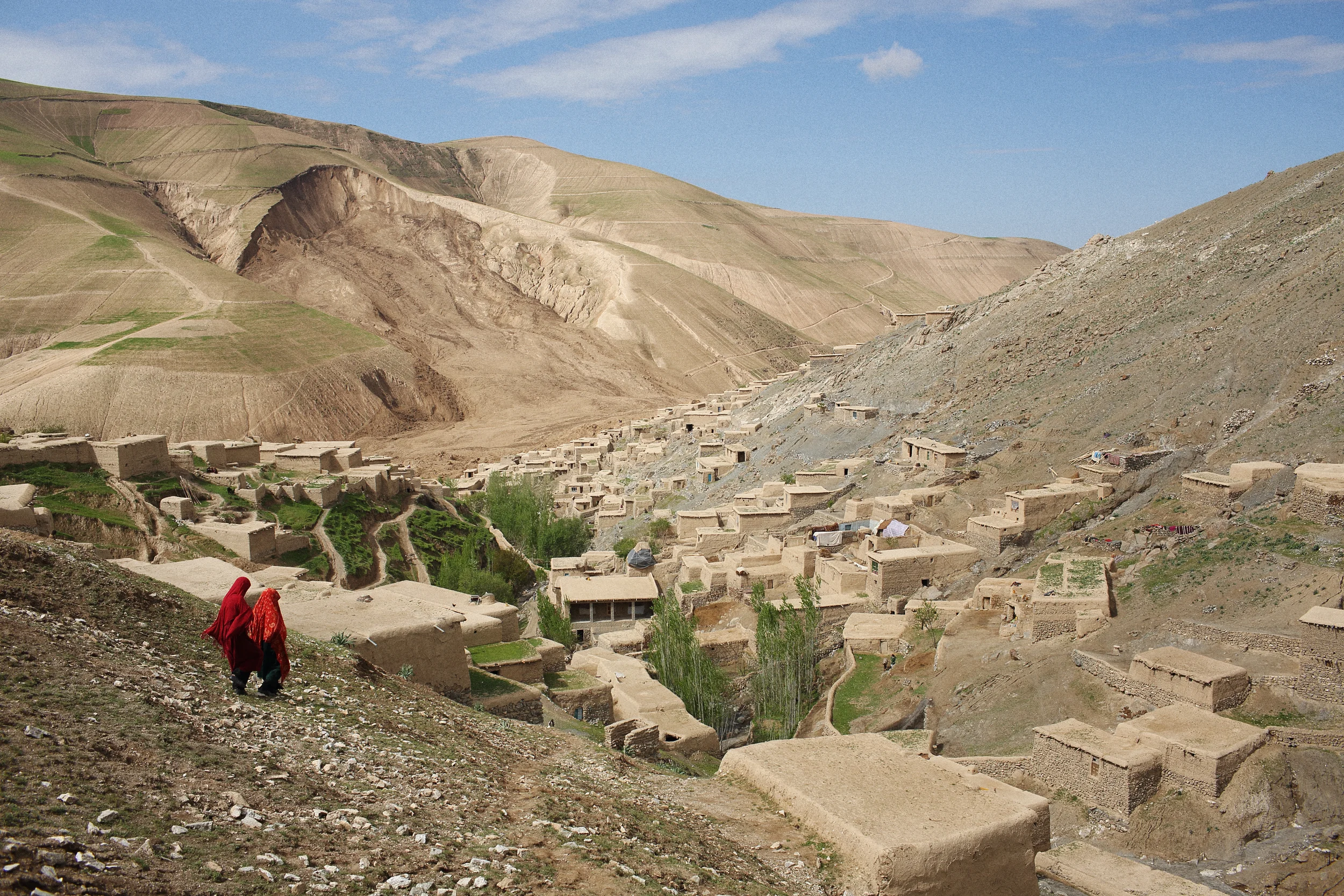  The remains of the village of Abi-Barek after part of a mountain across the valley succumbed to weeks of rain and buried hundreds of houses at the base of the valley days prior. Badakhshan Province, May, 2014. 