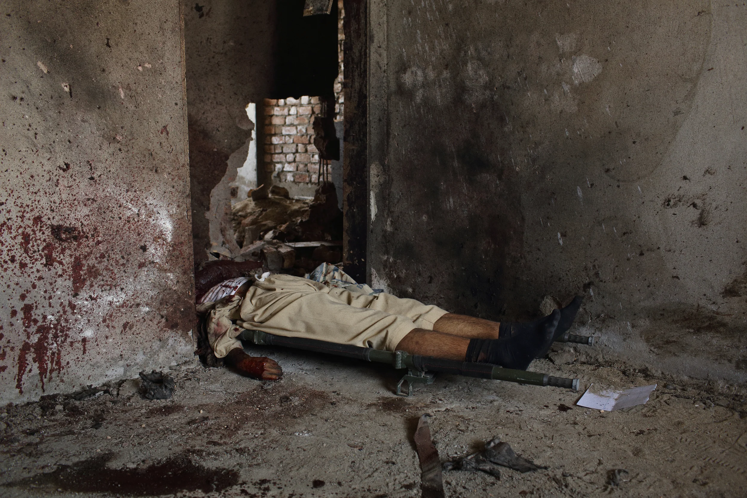  Five hours after several fighters mounted an attack against Kabul’s international airport, authorities prepared to remove what remained of their bodies from the vacant building they’d occupied, attacked from and fought the Afghan Crisis Response Uni