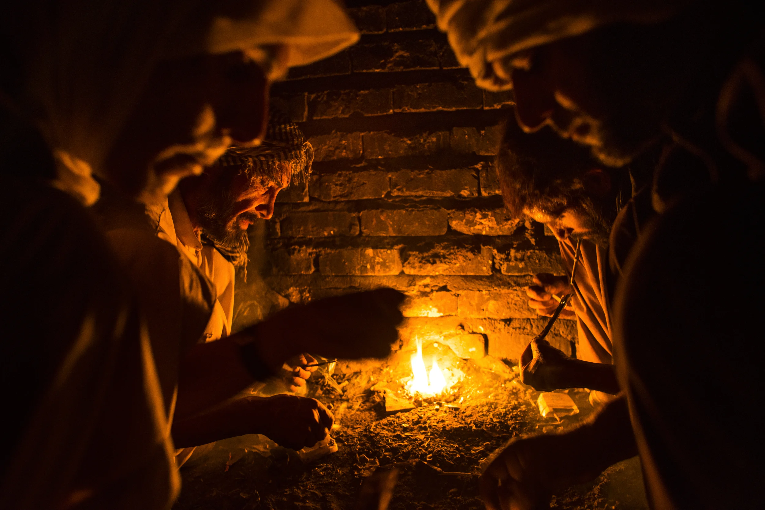  Drug addicts congregate in a disused building to smoke opium in Zaranj, in Afghanistan's far south west, on the border with Iran and Pakistan. Many said they picked up their addiction in Iran where they'd travelled to find work, only to be paid in d