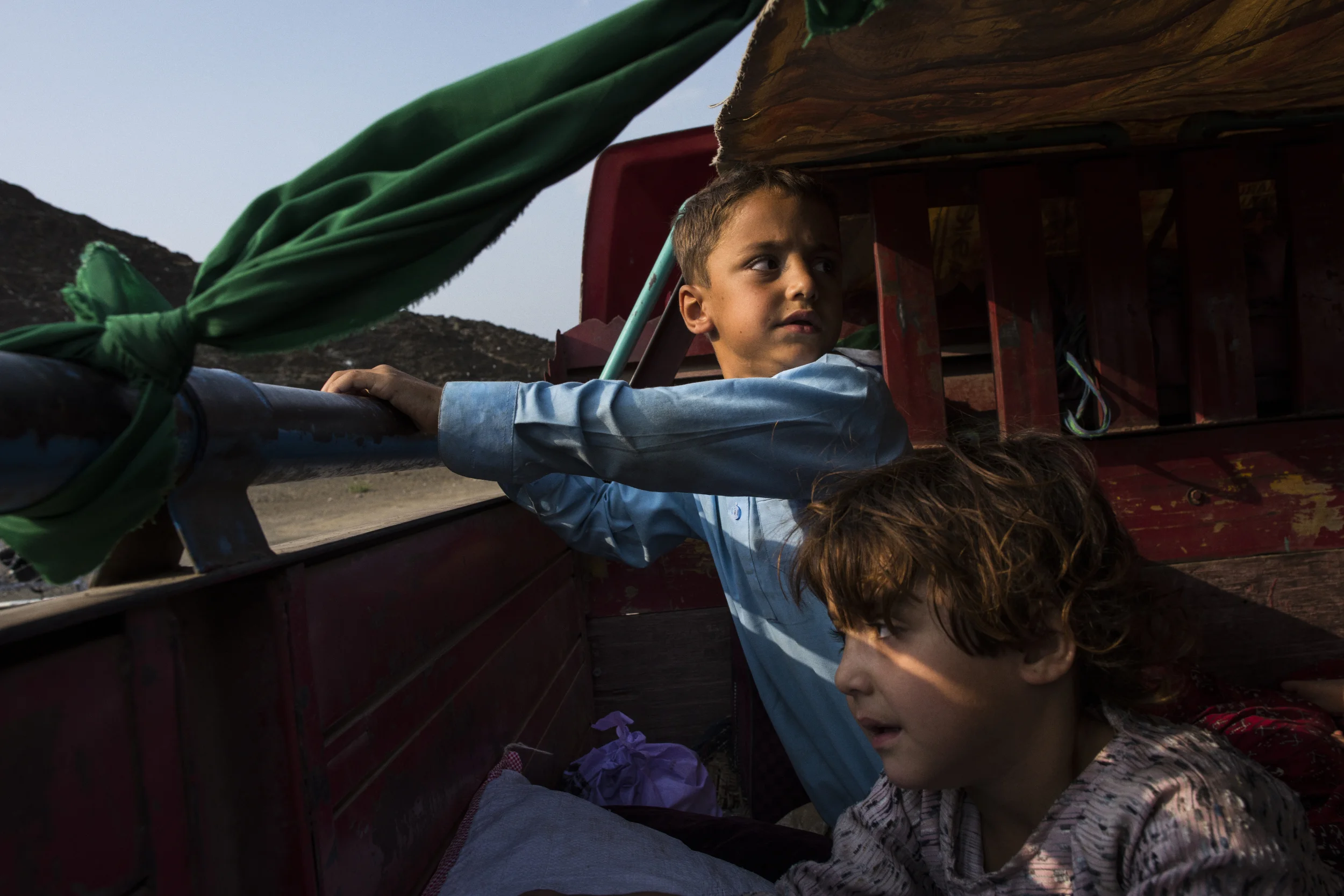  Kamran, who was undergoing medical treatment in Pakistan, rides with friends of his family, including Mariwa, who left their adopted home in Pakistan where they'd lived as undocumented refugees for 30 years before recent harassment from Pakistani au