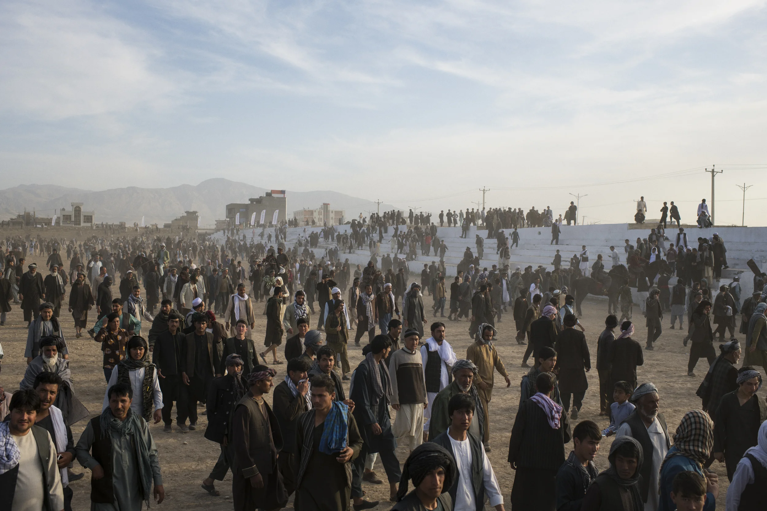  Spectators depart a buzkashi match in the northern city of Mazar-i Sharif on Nawroz, the Persian New Year. Balkh Province, March, 2018. 