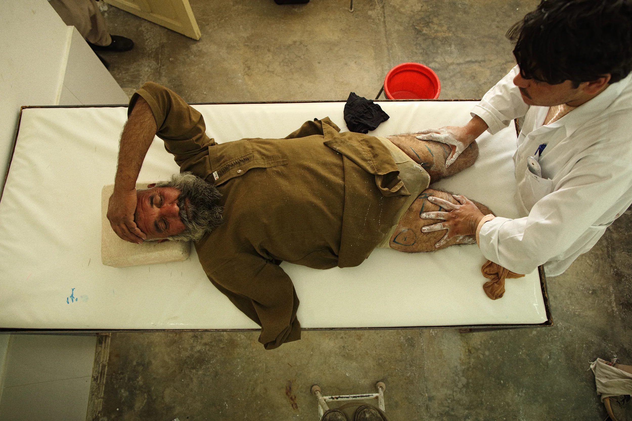  A triple amputee is fitted for prosthetic legs at an International Committee for the Red Cross orthopaedic centre in southern Afghanistan. Helmand Province, April, 2015. 