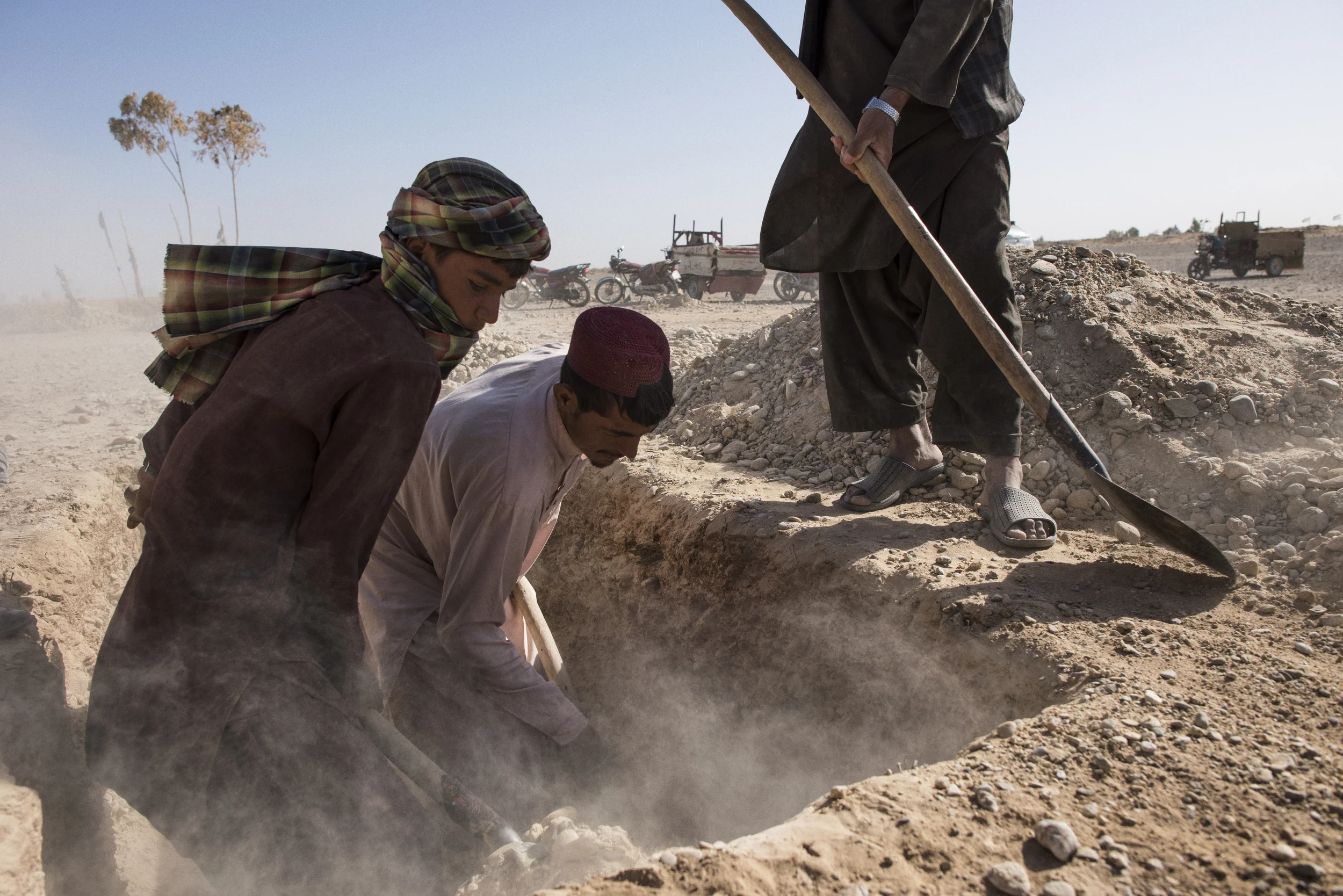  Friends and relatives of Abdul Hakim, aged between 14-16, dig his grave in Bolan, on the outskirts of Lashkar Gah. Hakim, his family said, studied at a madrassa in Chaman, on the border with Pakistan, but was killed by gunfire on the Kandahar Highwa