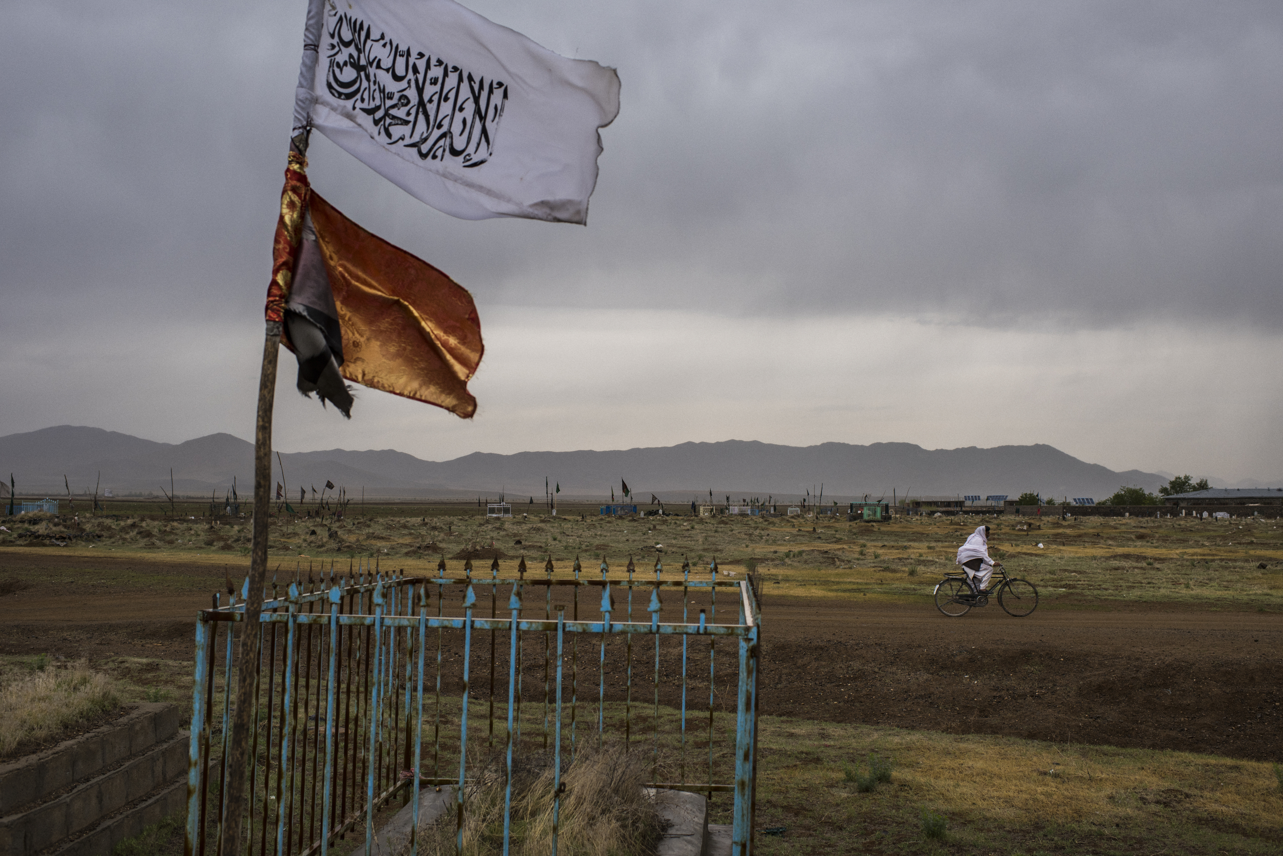  A Taliban flag flies over a grave in a cemetery where Afghan soldiers are also buried, in Maughulkhil area of Muhammad Agha District. Logar Province, April, 2017. 