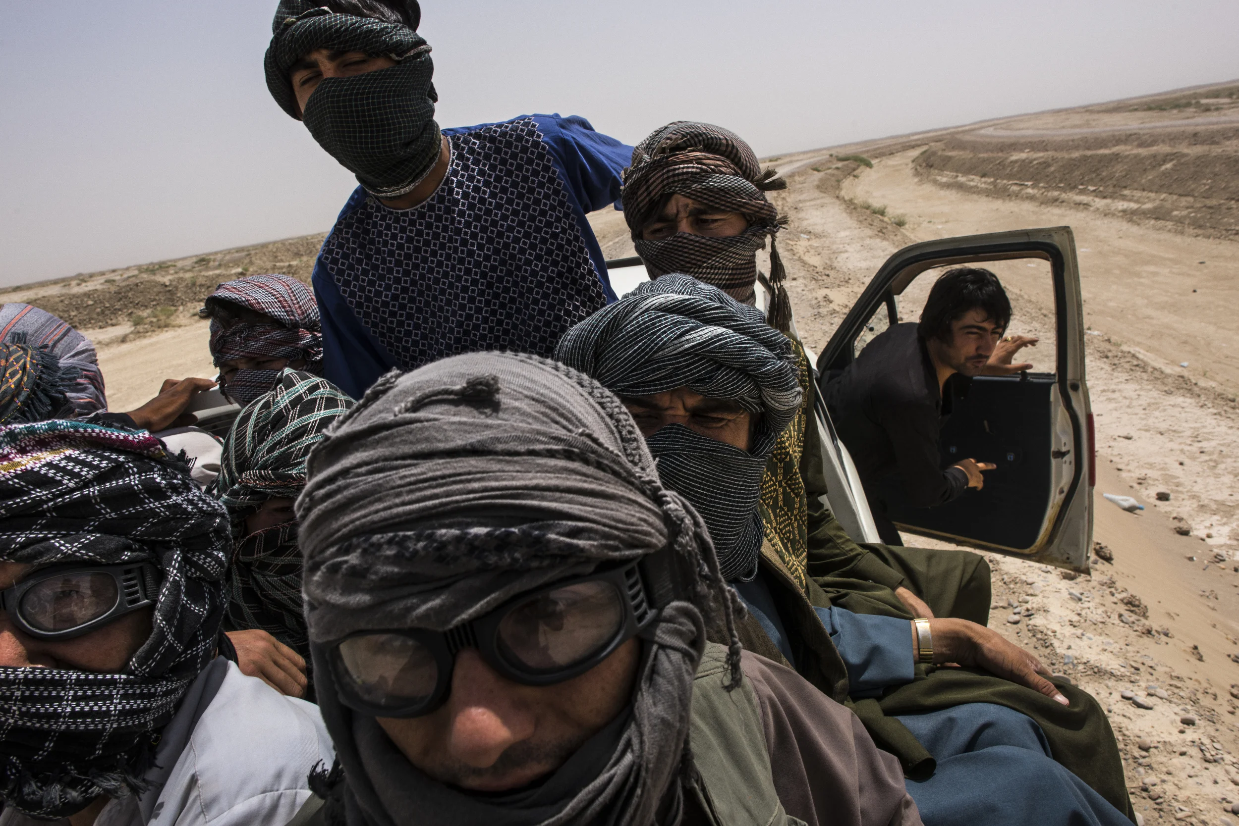  In the back of a pick-up truck driven by a smuggler, or rabalat (guide), a dozen Afghans, as well as those in the cabin, begin the second leg of their journey (the first being from their home provinces to Zaranj) as undocumented migrants, from the s