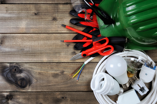 top-view-of-work-tools-and-electrical-system-components-on-wooden-picture-id912952312.jpeg