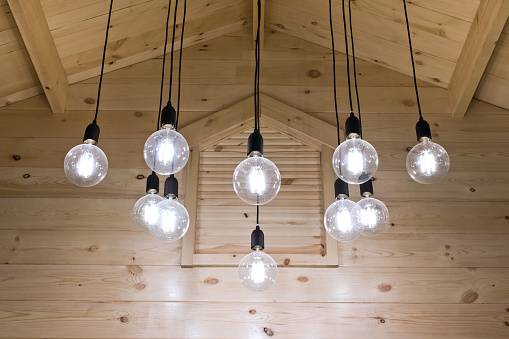 electric-light-bulb-under-the-ceiling-picture-id531399862.jpeg
