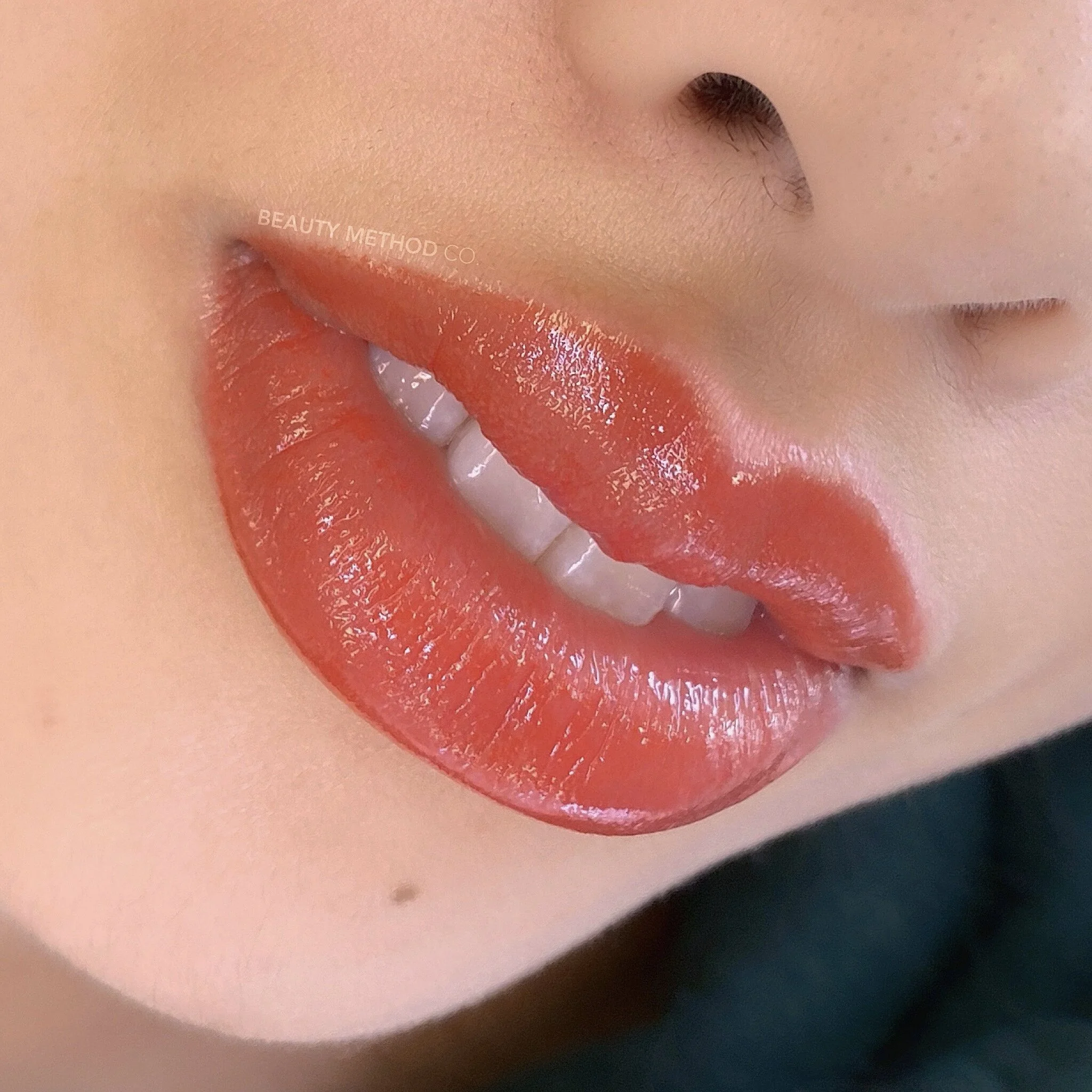 Close-up of a woman’s lips with lip blush, which creates the illusion of fuller, plumper lips and even color.