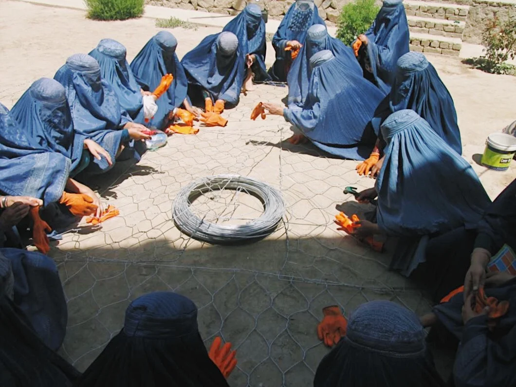 Women attending a Gabion Weaving Training course through our vocational training program
