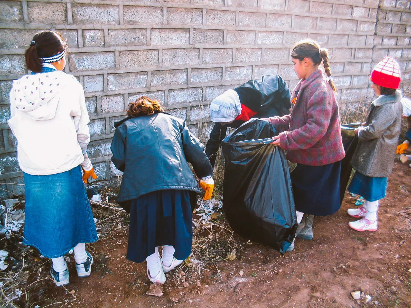Students picking up rubbish around the school