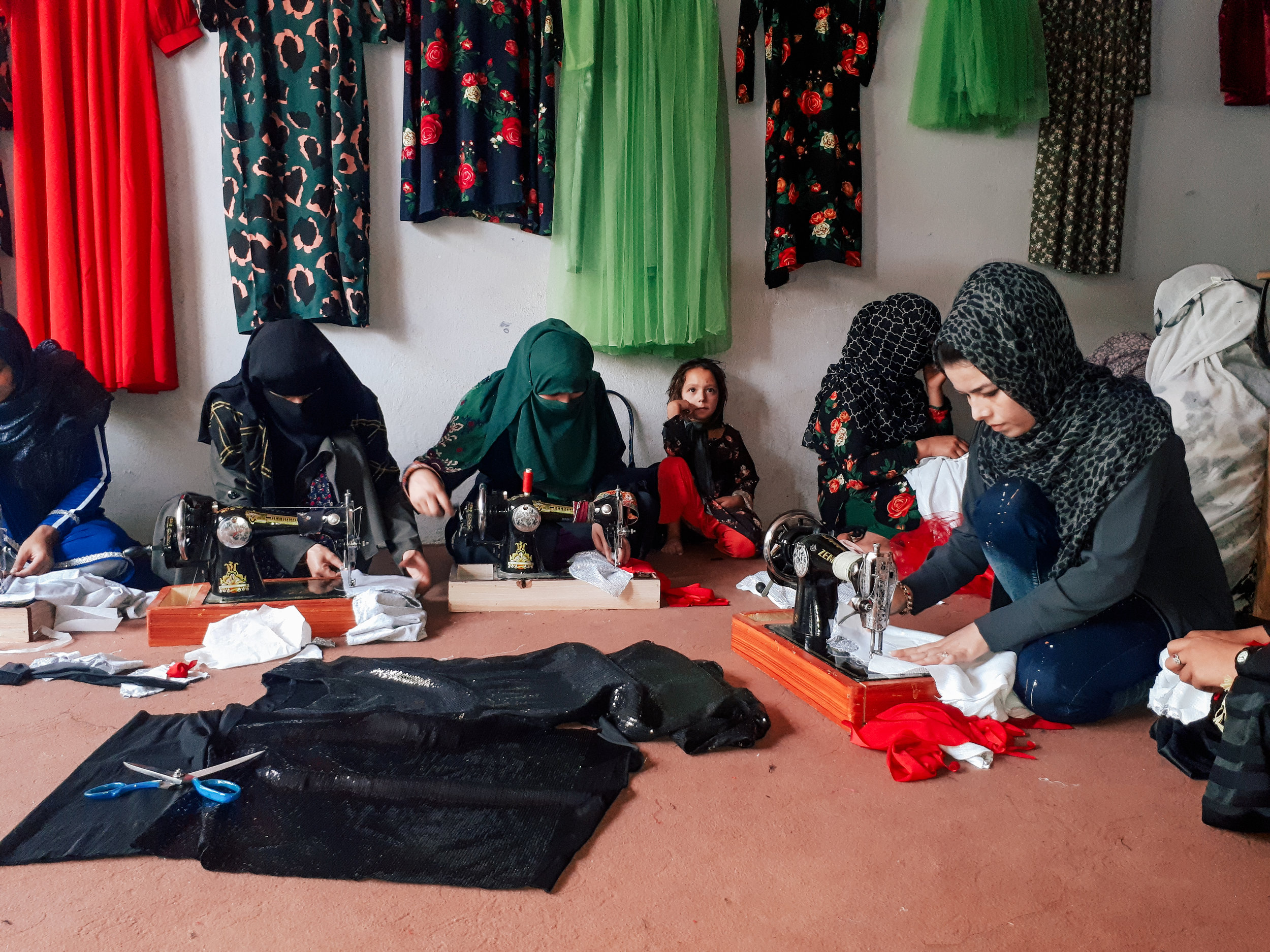 Women from Taloqan District learning tailoring skills.
