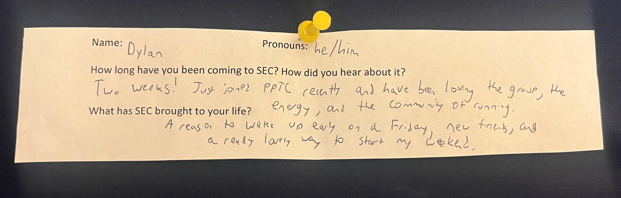 An image of a slip of paper with typed questions and hand written answers. The paper is pinned to a navy blue background with a yellow thumbtack. The contents of the writing are written below the photo.