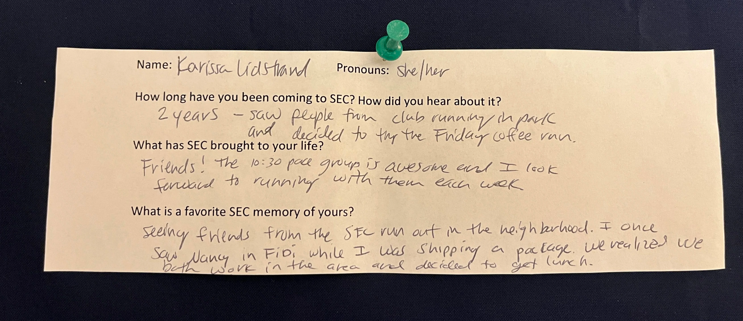 An image of a slip of white printer paper with typed questions and hand written answers. The paper is pinned to a navy blue background with a green thumbtack. The contents of the writing are written below the photo.
