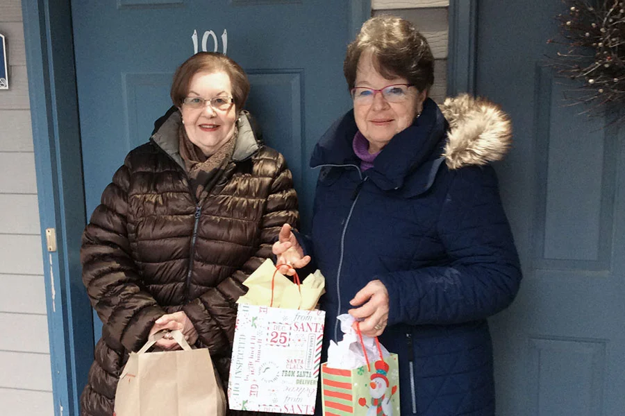 Delivering food and gifts to needy families.