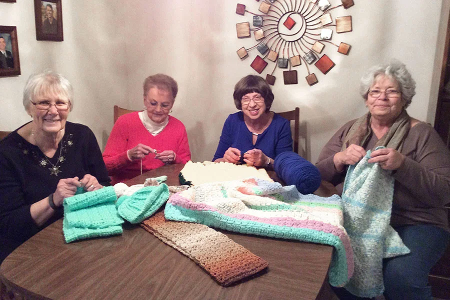 Knitting blankets and booties for the newborns!