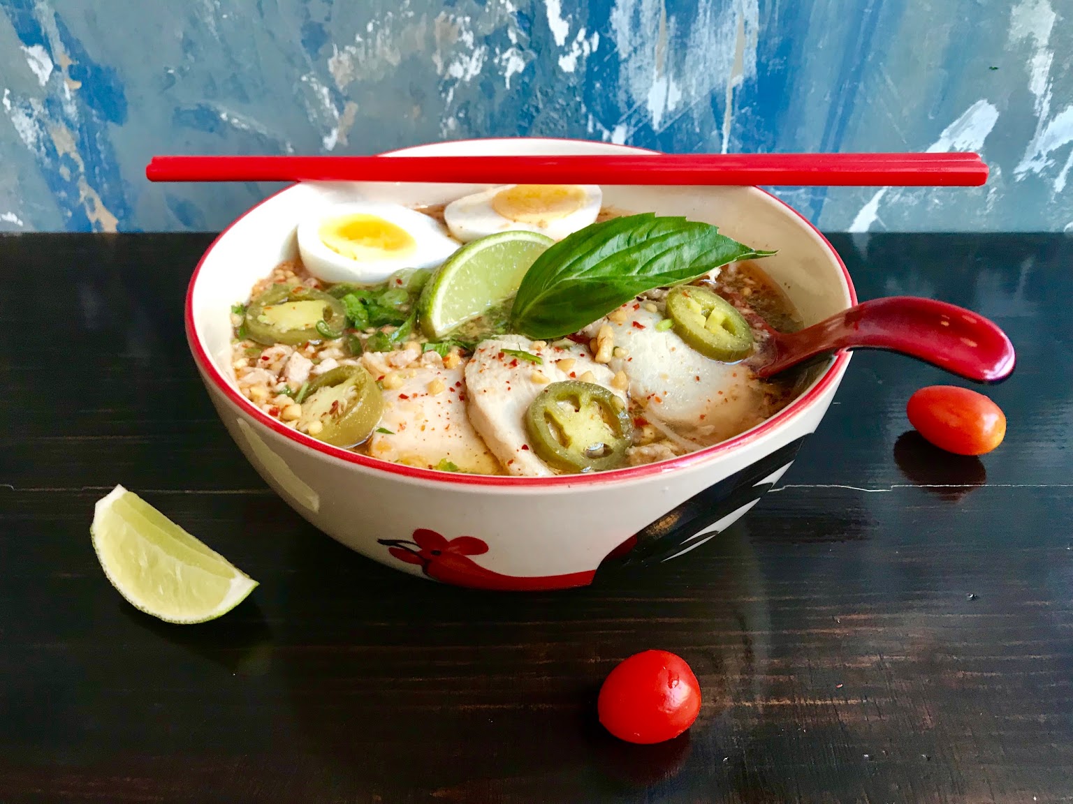 Tonkotsu Ramen served with pork broth, fish cake, seaweed, egg and noodles