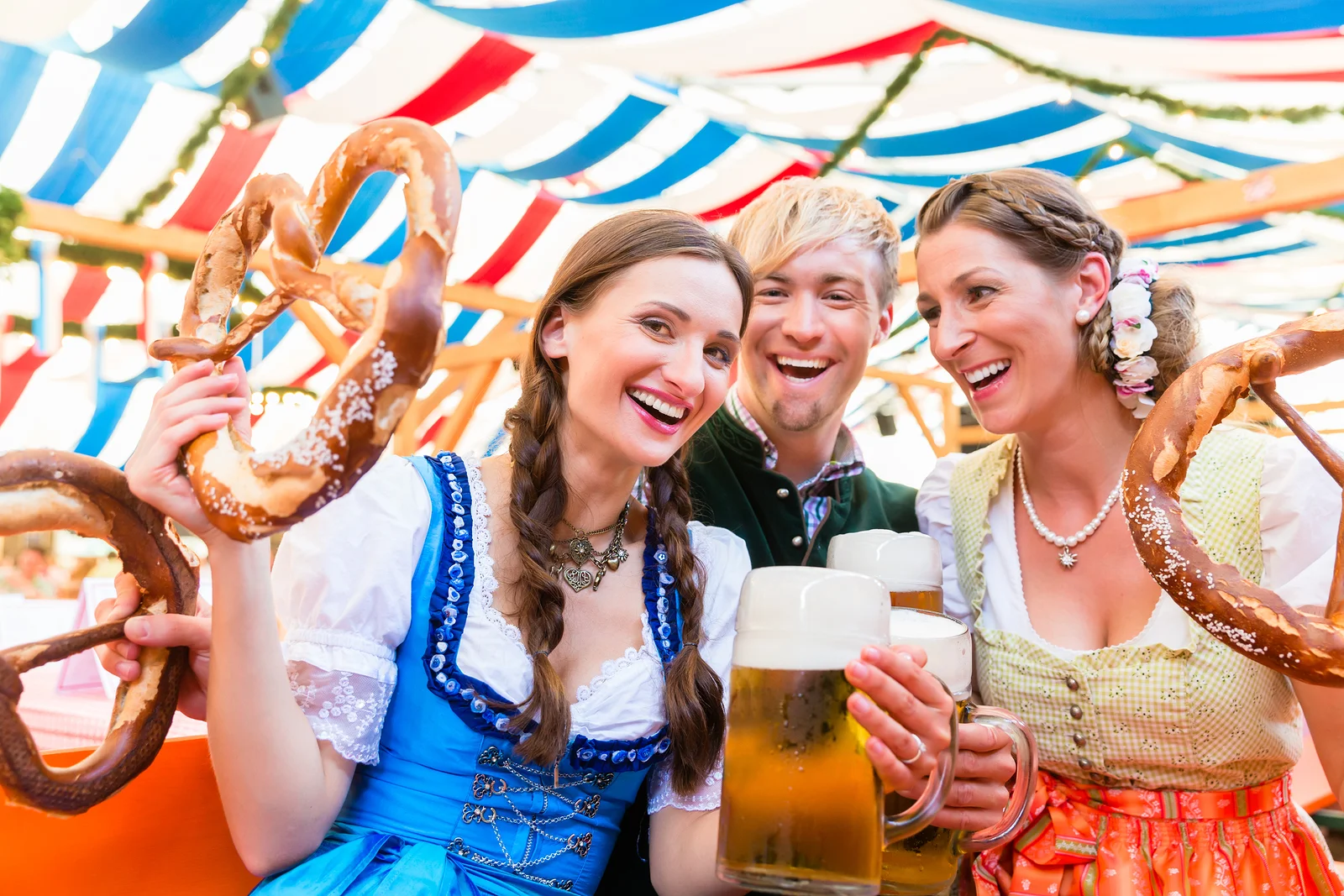 bigstock-Three-friends-in-beer-tent-at--143615687.jpg