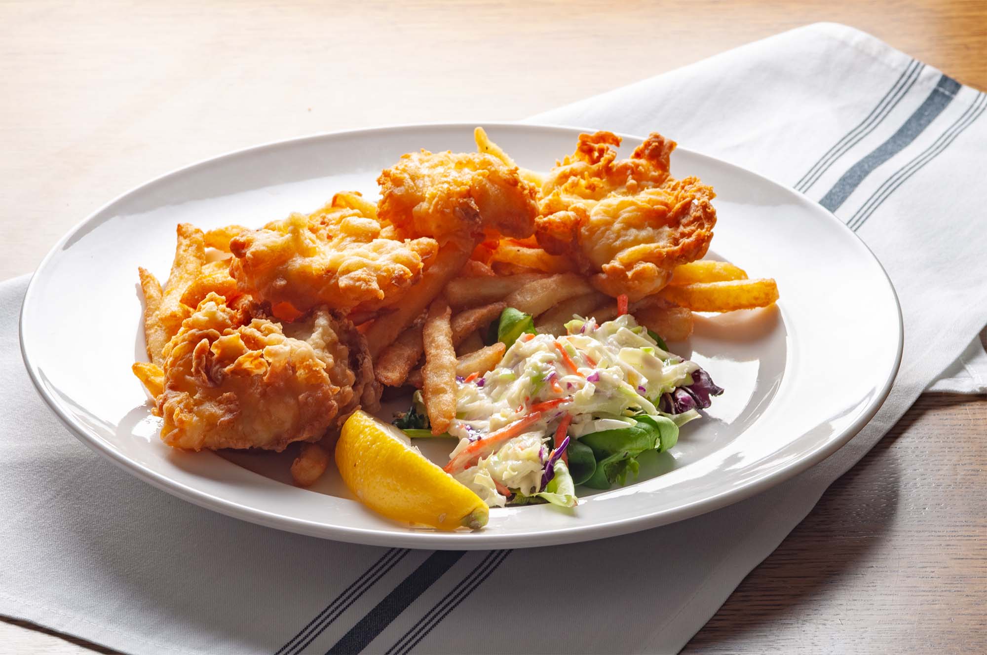 fish and chips with fries and coleslaw