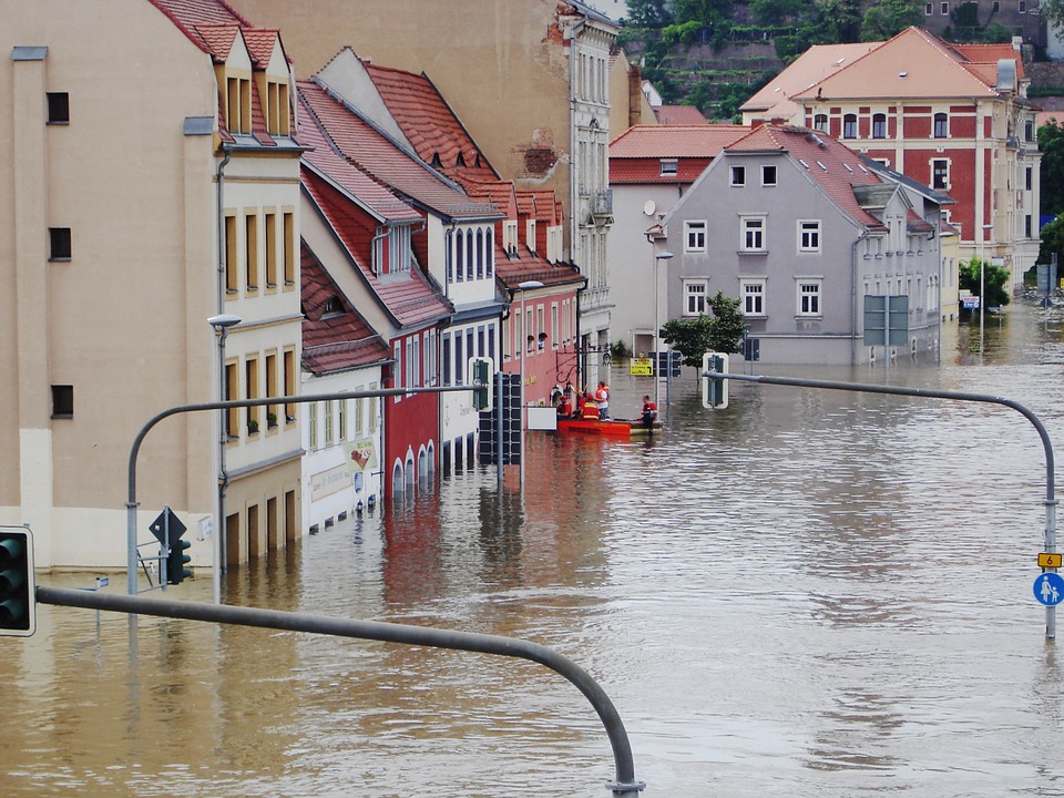  A flooded street lined with buildings 