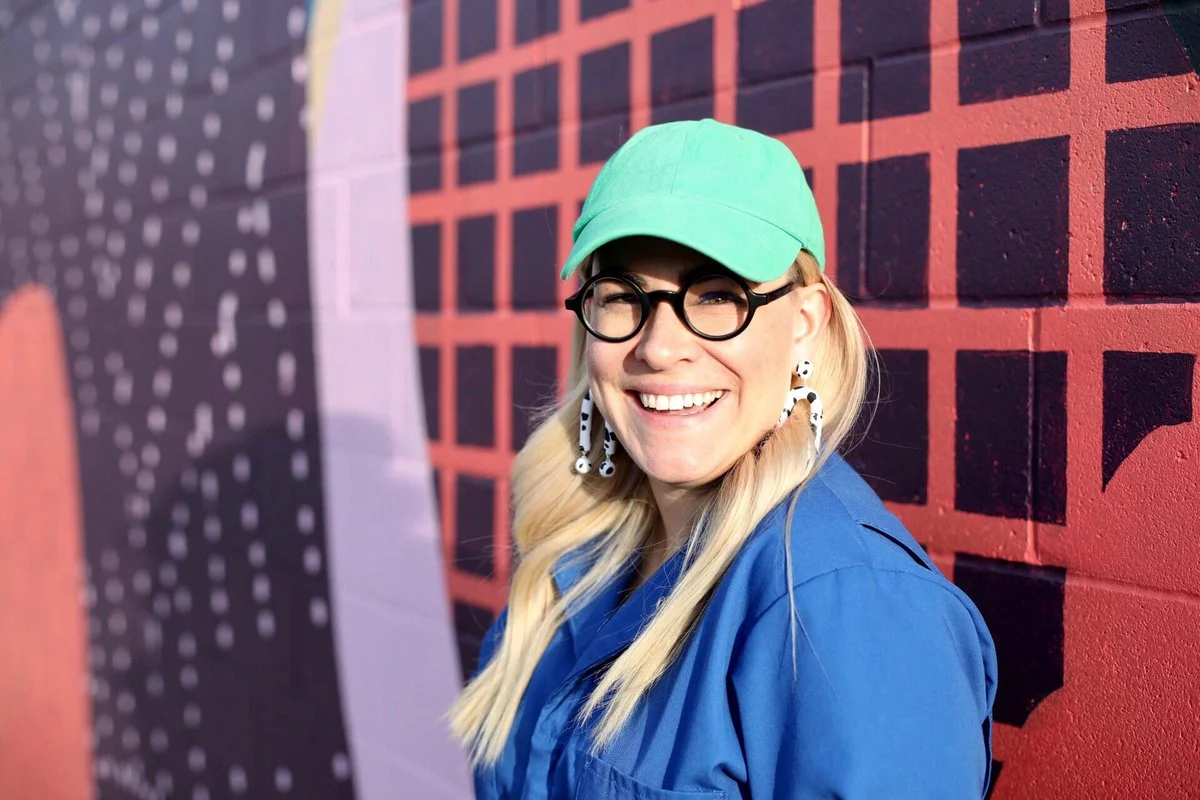 Meg Lewis is a value-based designer creating experiences for happy companies and happier lives for humans of all kinds. She’s 1/4 of Ghostly Ferns, a collective of designers & commercial artists and the co-owner of Fool Proof, a shared workspace for creativity & collaboration in Minneapolis. She specializes in creating positive emotional connections between companies and their community by adding personality to their brand. She coaches brands on how to become a happy company and individuals on how to make money being themselves!