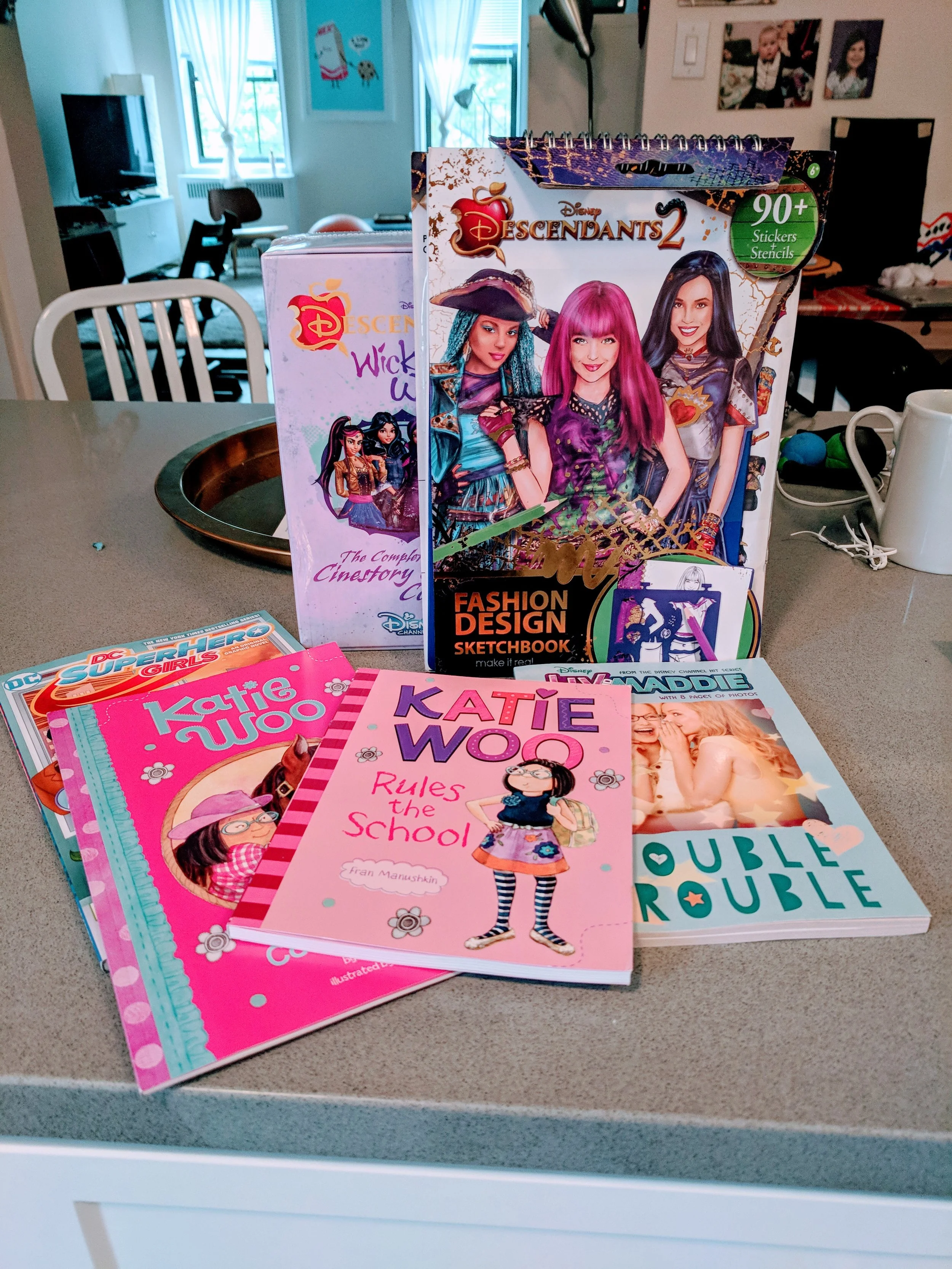 Some cool stuff I'm reading lately. Katie Woo , Descendants , DC Superhero Girls , and Liv & Maddie .