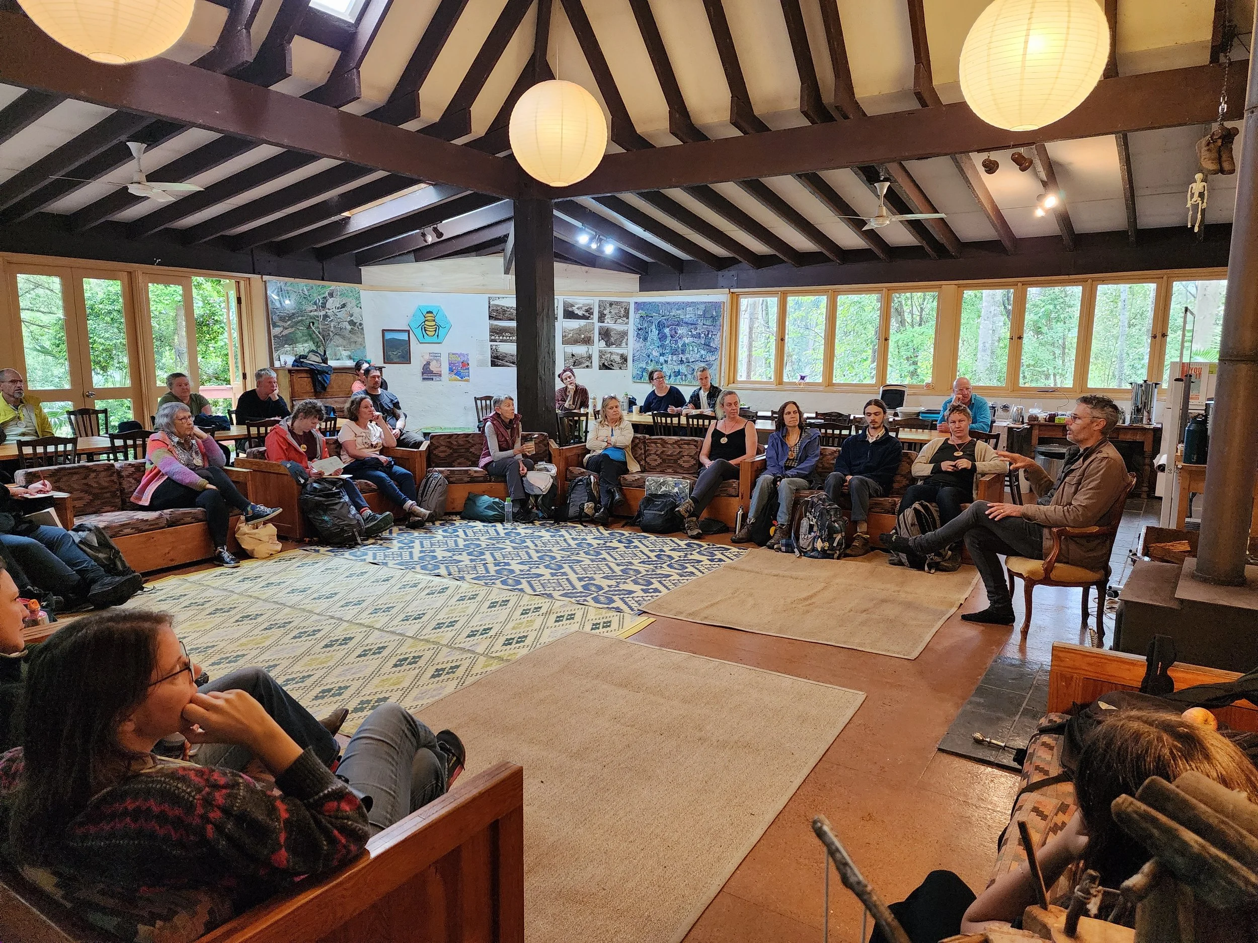 Group sits on lounges in large event room, at Wangat Lodge, in Barrington, Hunter Valley, NSW