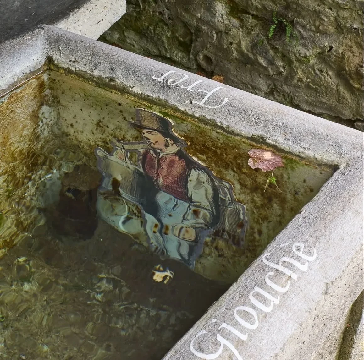 @marcomandorlini_ 
Site specific work on Fountain. 2023
The submerged images transform the imagery of the fountain into that of an aquarium that holds the ironic conflicts related to the nicknames of the various hamlets in the municipality of Lozio.