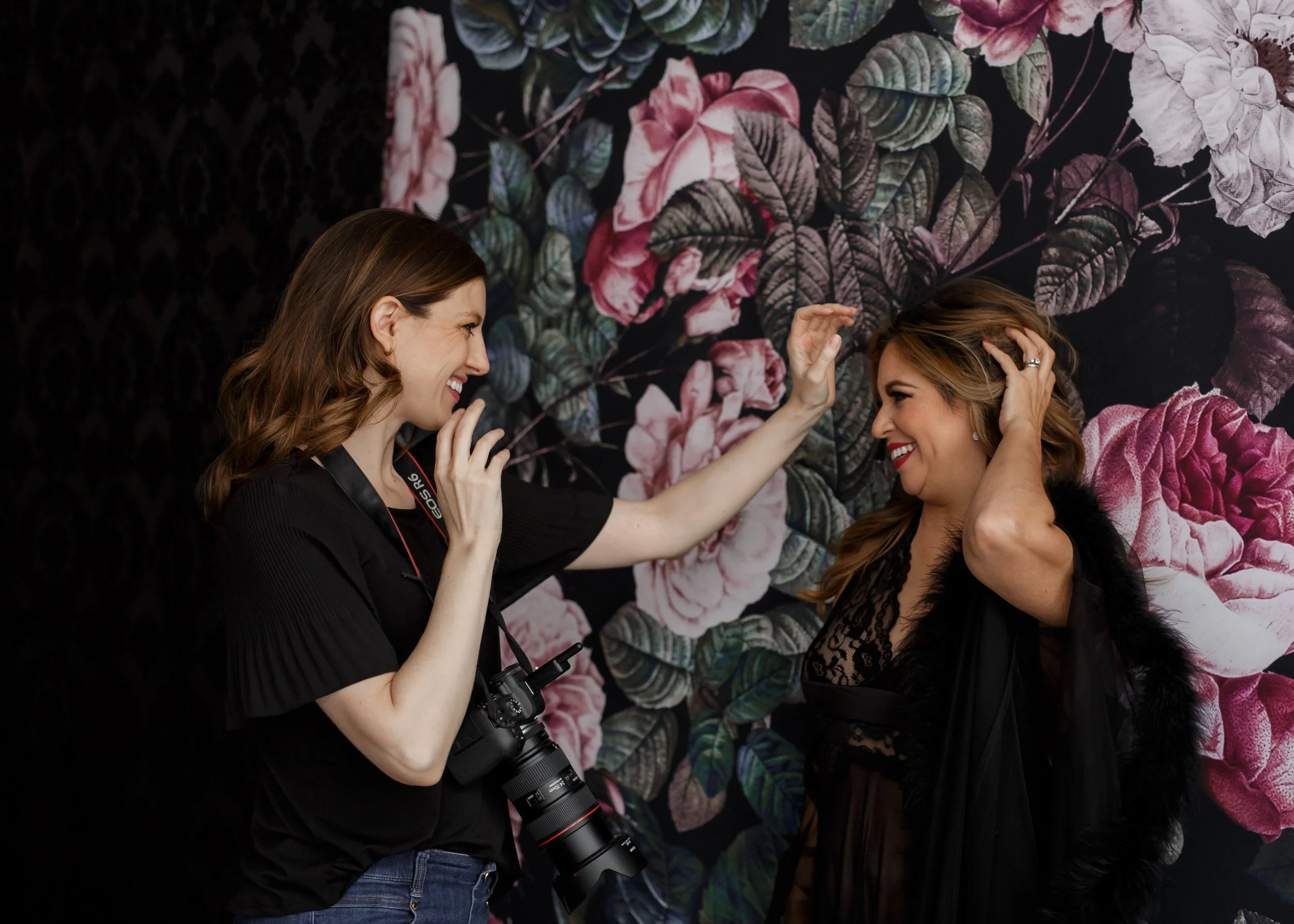 Confident woman posing in boudoir session with professional hair and makeup