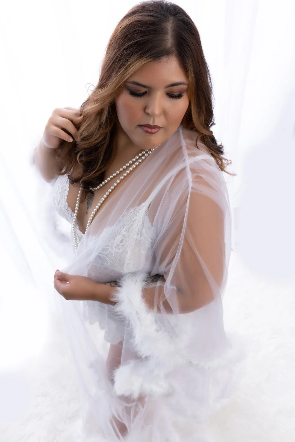 Bride in white lingerie for a boudoir photoshoot