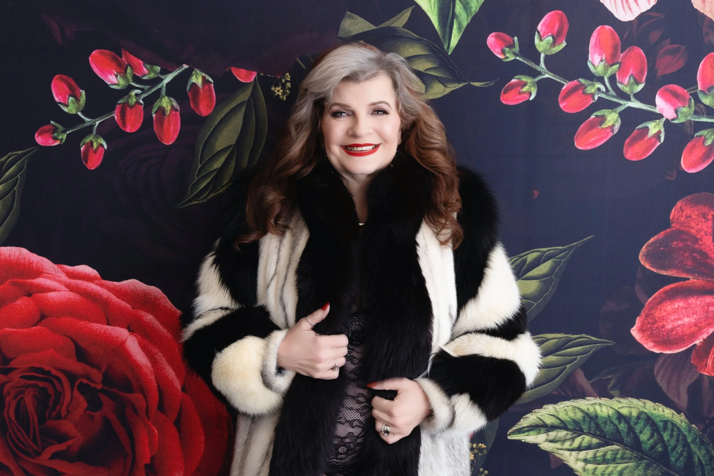 Mature woman enjoying a confident boudoir photoshoot in a high-end Chicago photography studio