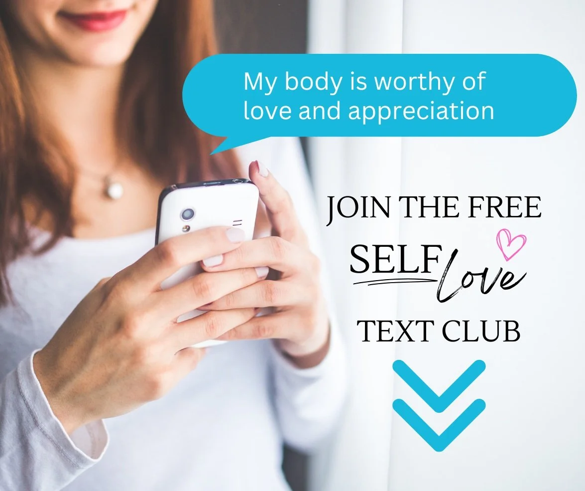 Woman smiling while reading a self love affirmation text message on her phone