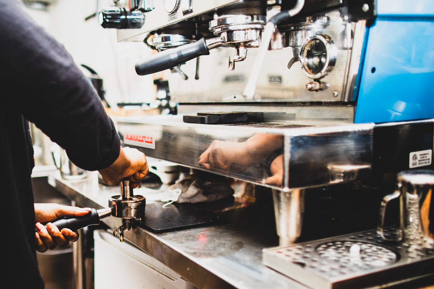 Preparing the cappuccino.