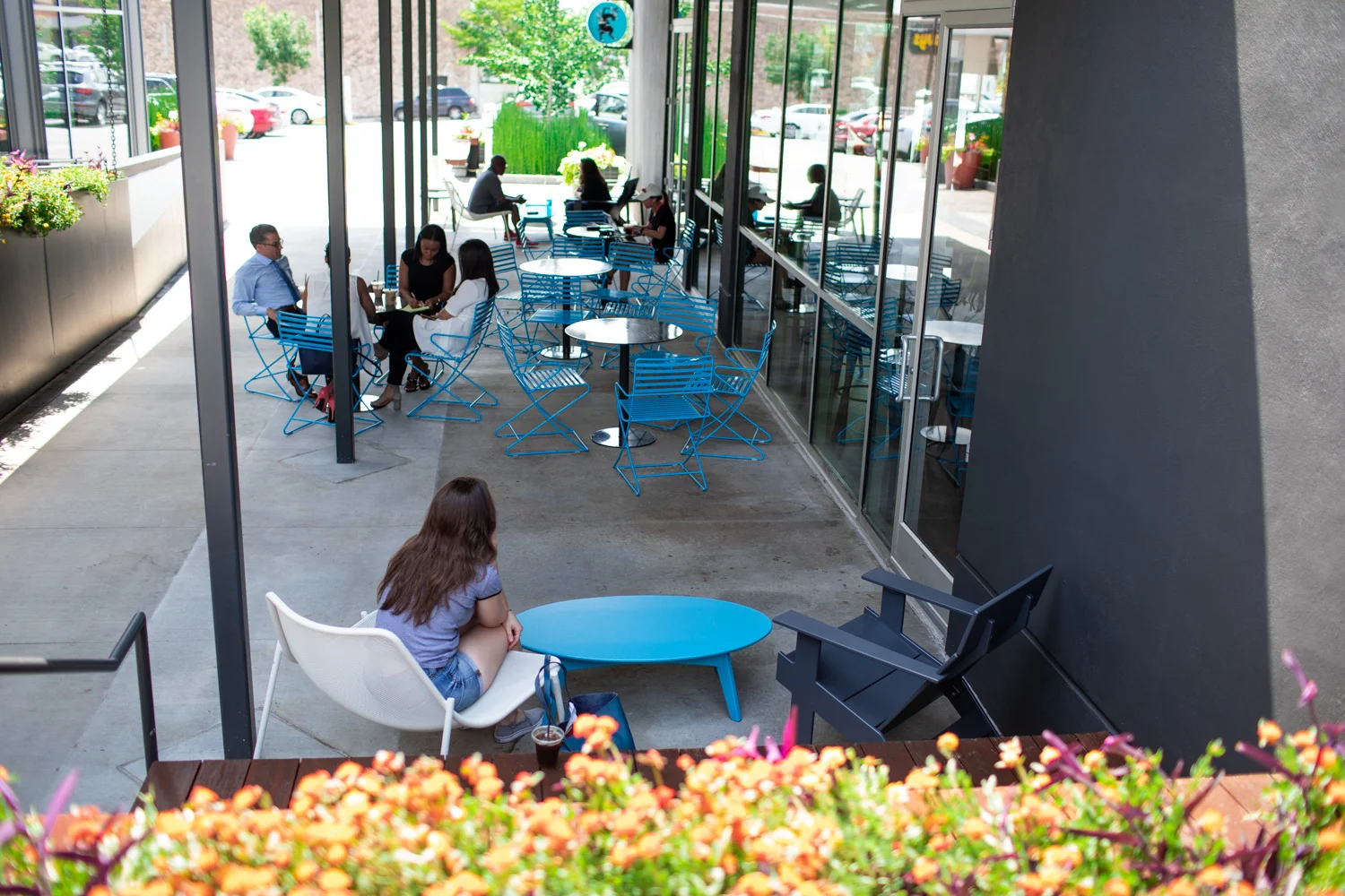 An outdoor patio at Dancing Goats in Buckhead. The outdoor seating is covered and is well-shaded.