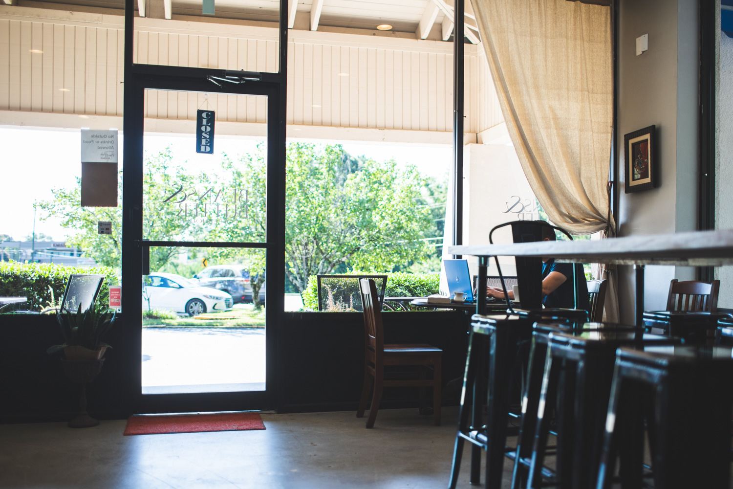 Interior of Beans & Butter Coffeehouse. There is plenty of seating inside.
