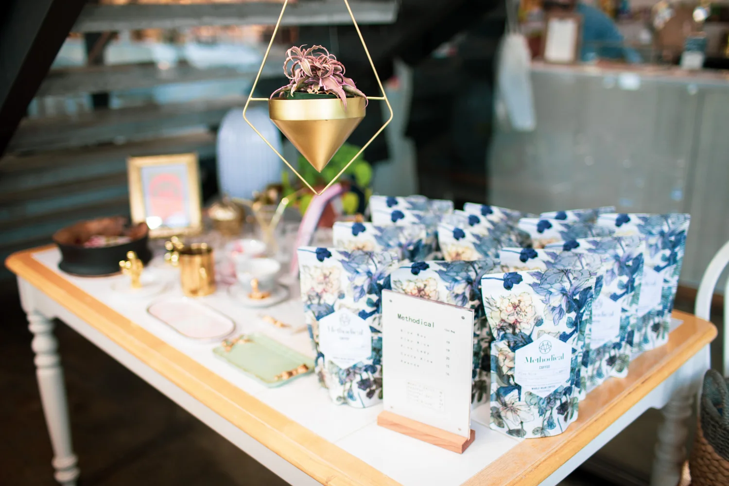 A table at Momo Cafe. Bags of Methodical Coffee are available for purchase.