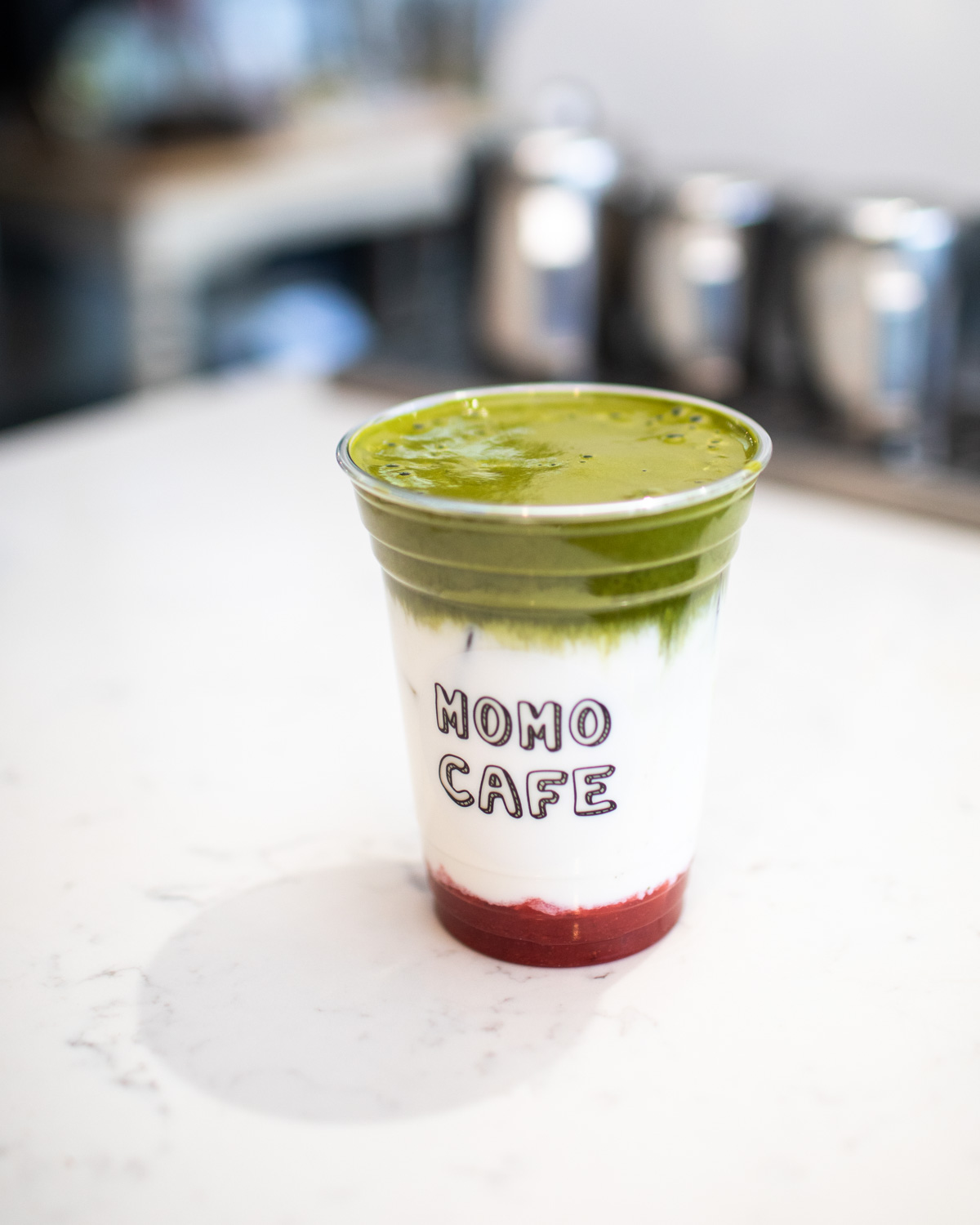 The iced strawberry matcha drink at Momo Cafe—prior to mixing.