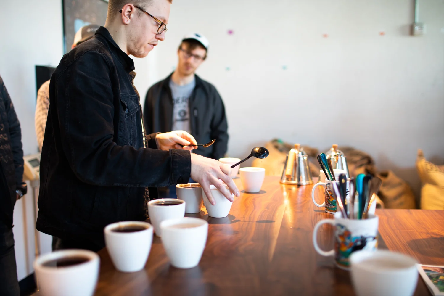 Coffee cupping at East Pole. Whit, holding the two spoons, led the event.