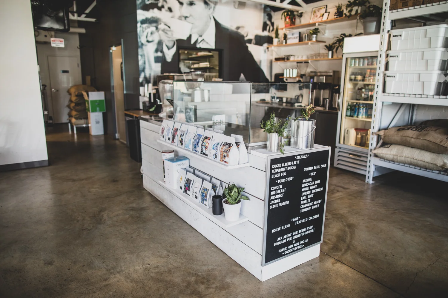 Wide-angle view of the interior of Docent Coffee. The coffees on the two rows are profiled in this section .