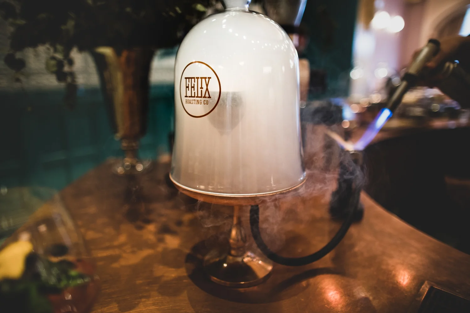 Step 2: Allow the hickory smoke from the burning hickory chips to envelop the drink and marshmallow for approximately thirty seconds.