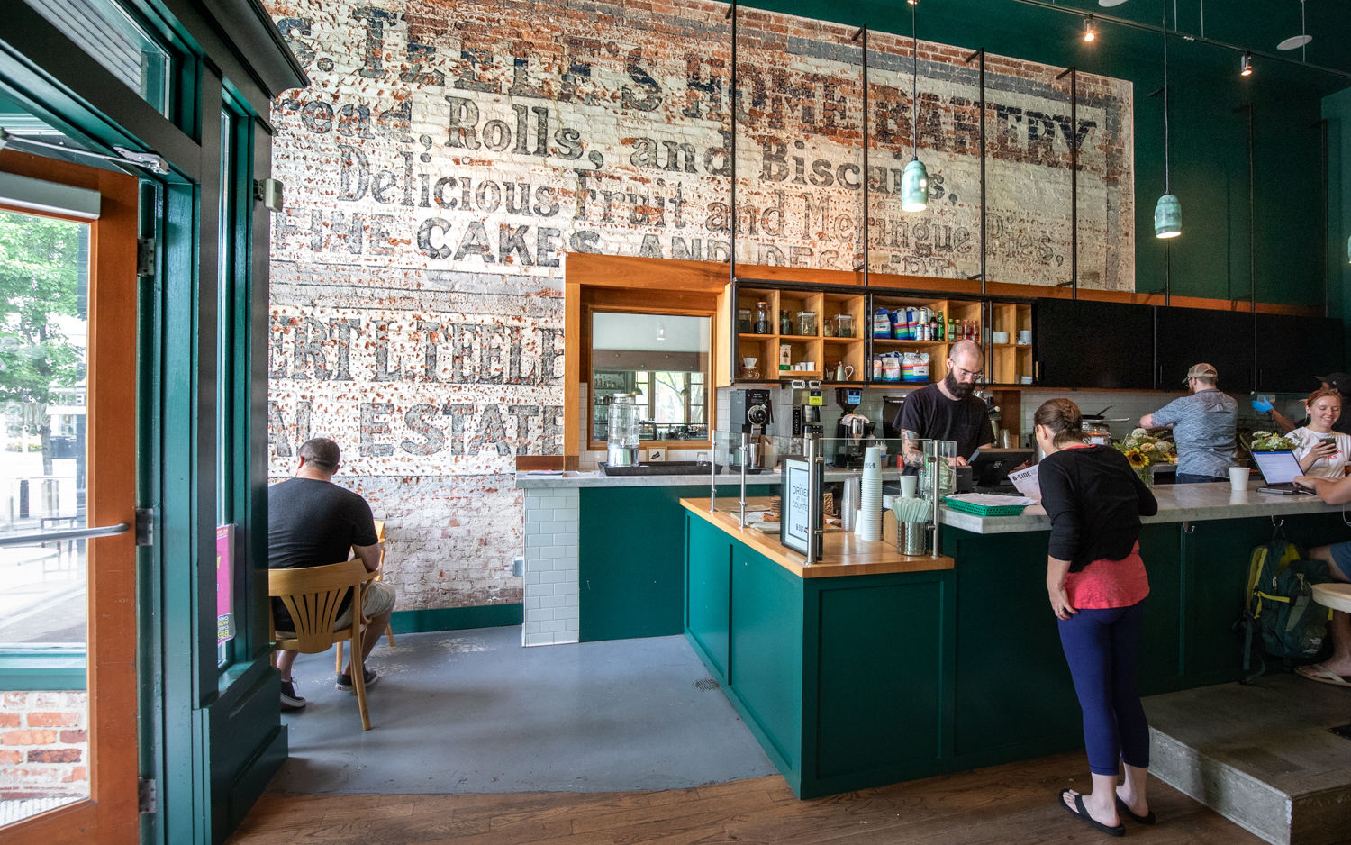 Interior views at the B-SIde Cafe. Note the elevated bar seating area that begins at the right of frame.