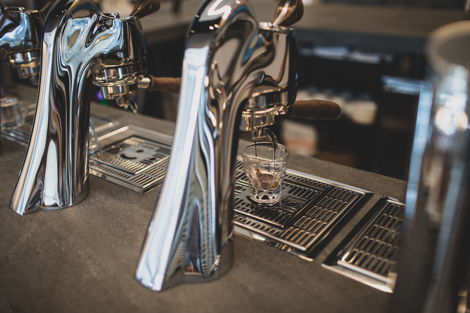 An espresso on pull from a Modbar set-up.