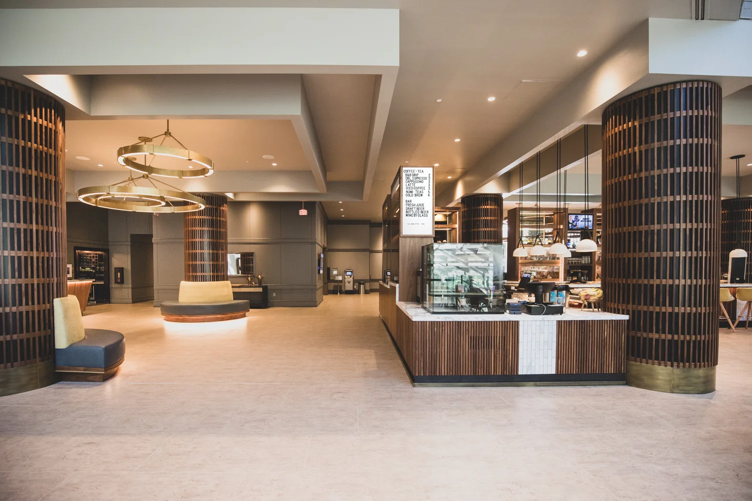 A wide-angle view of Lightwell Cafe & Cocktails and the surrounding lobby area at the Crowne Plaza Perimeter Hotel at Ravinia.