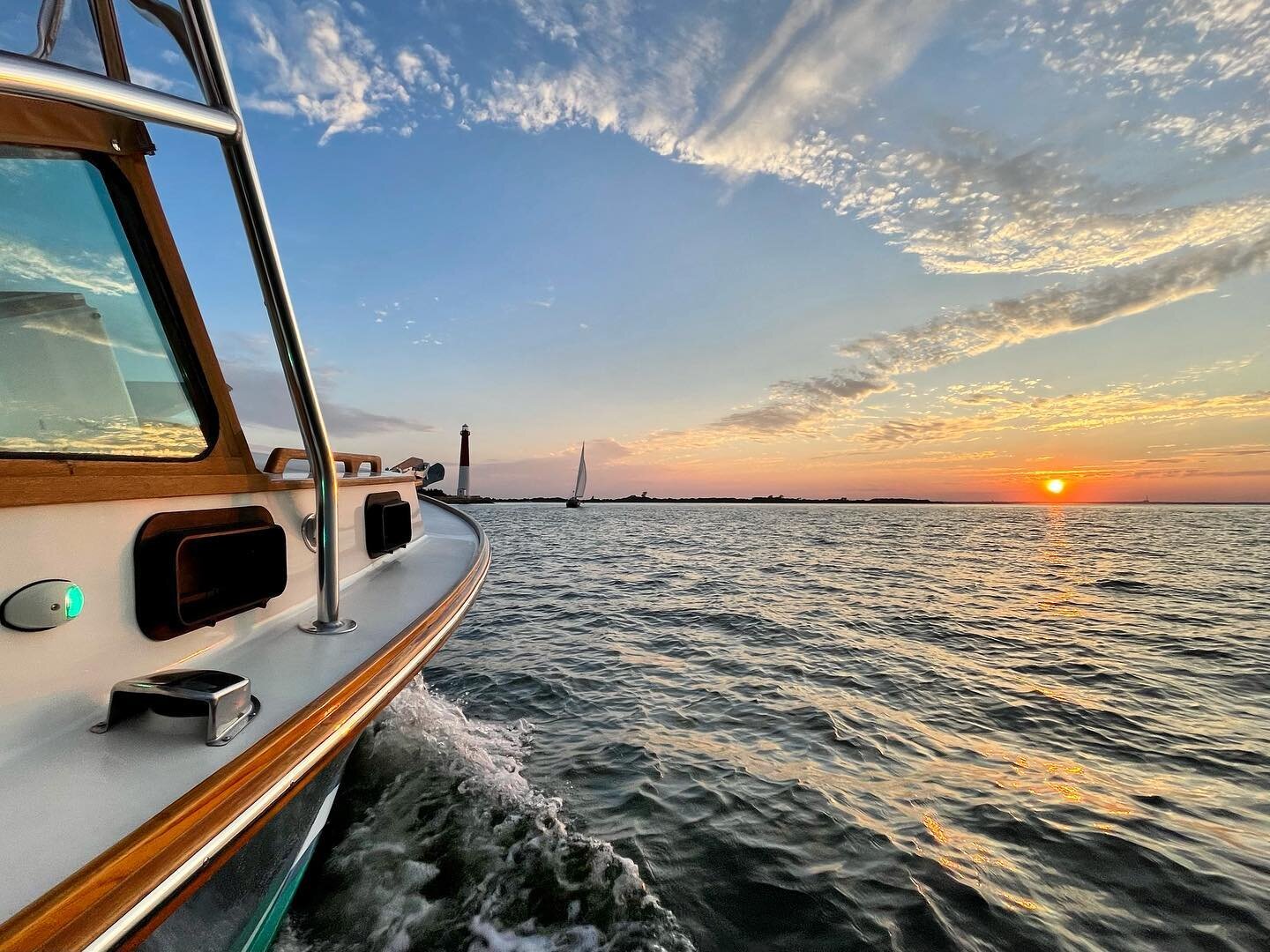 Setting sail into serenity 🌅⛵️ gracefully gliding through the calm waters of Barnegat Inlet, NJ, as the sun bids farewell to another beautiful evening. 🌊✨ 

#SunsetCruise #ClassicCharter #BarnegatInlet #NJBoating #SerenityAtSea #LBIluxurycharters #