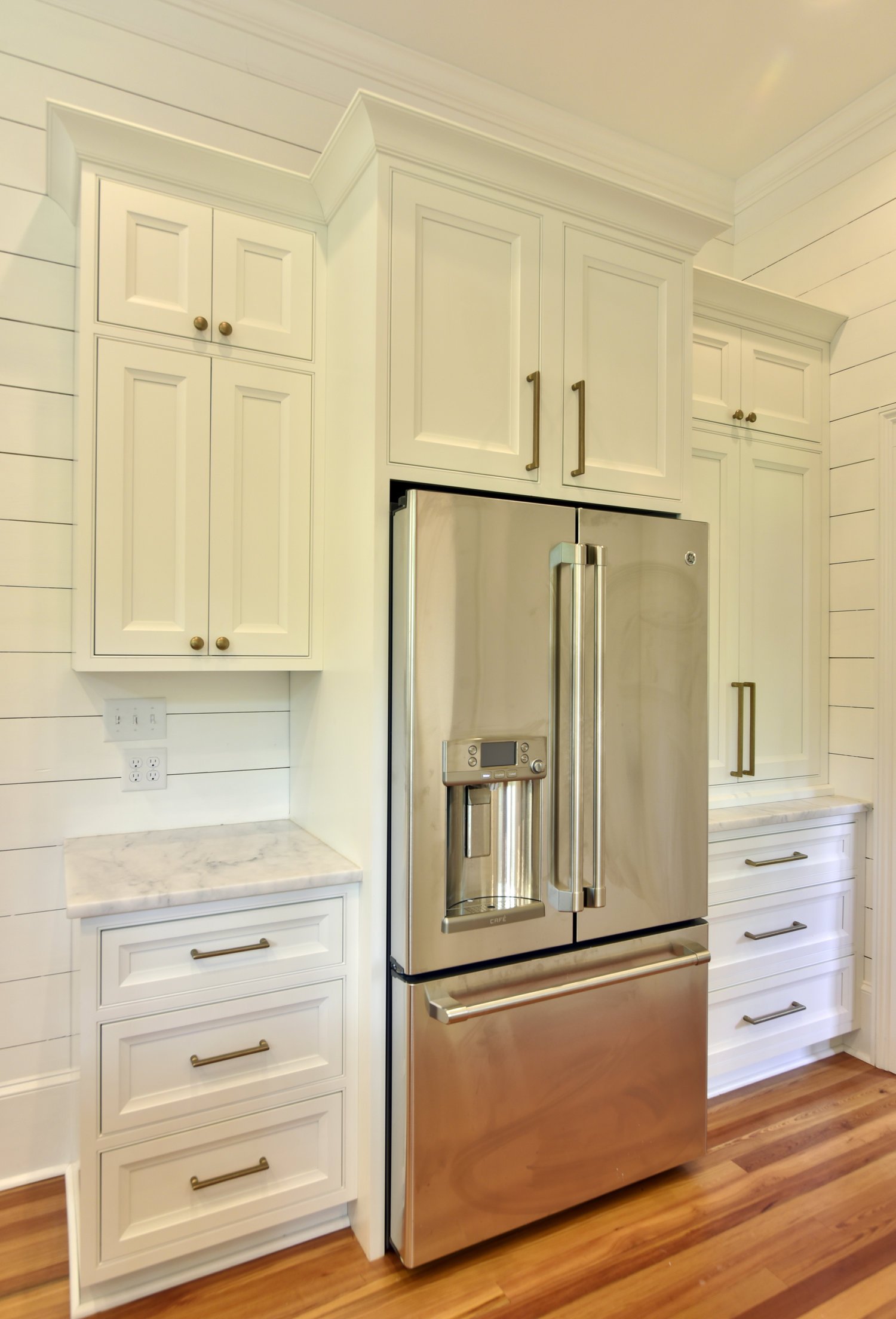 Copper, White, &amp; Natural Light Kitchen Cabinetry