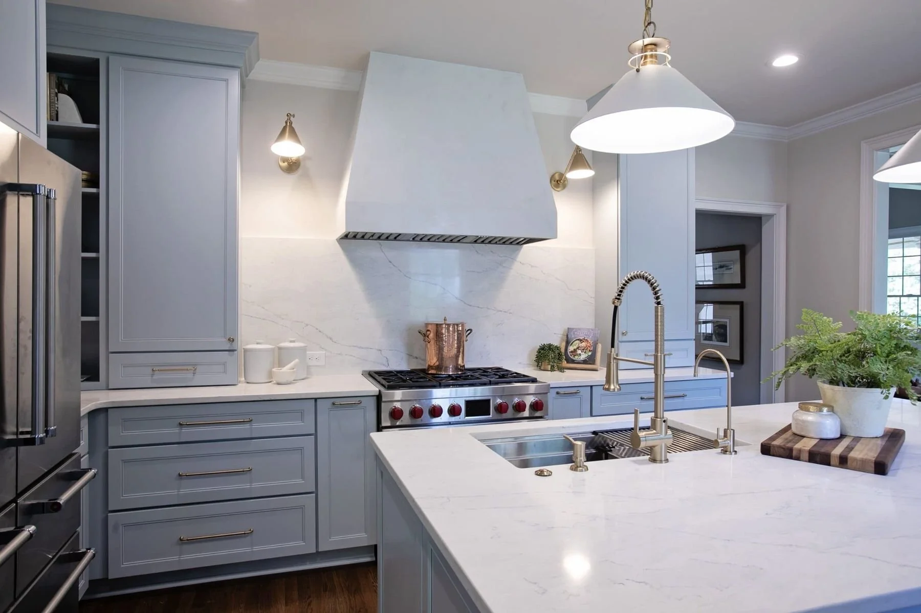 Luxury kitchen with custom gray cabinets, quartz island, designer lighting, and premium finishes in Reynolds Lake Oconee, Greensboro, GA.