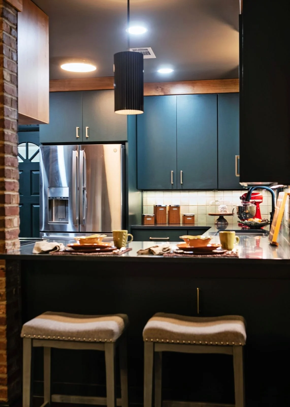 dark-green-kitchen-breakfast-bar-custom-cabinetry.jpg