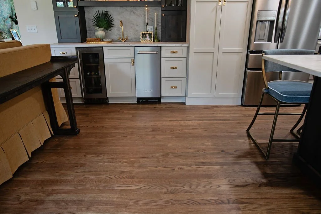 Hardwood flooring finished in a medium stain and installed by Pool Brothers in Moultrie, Georgia.