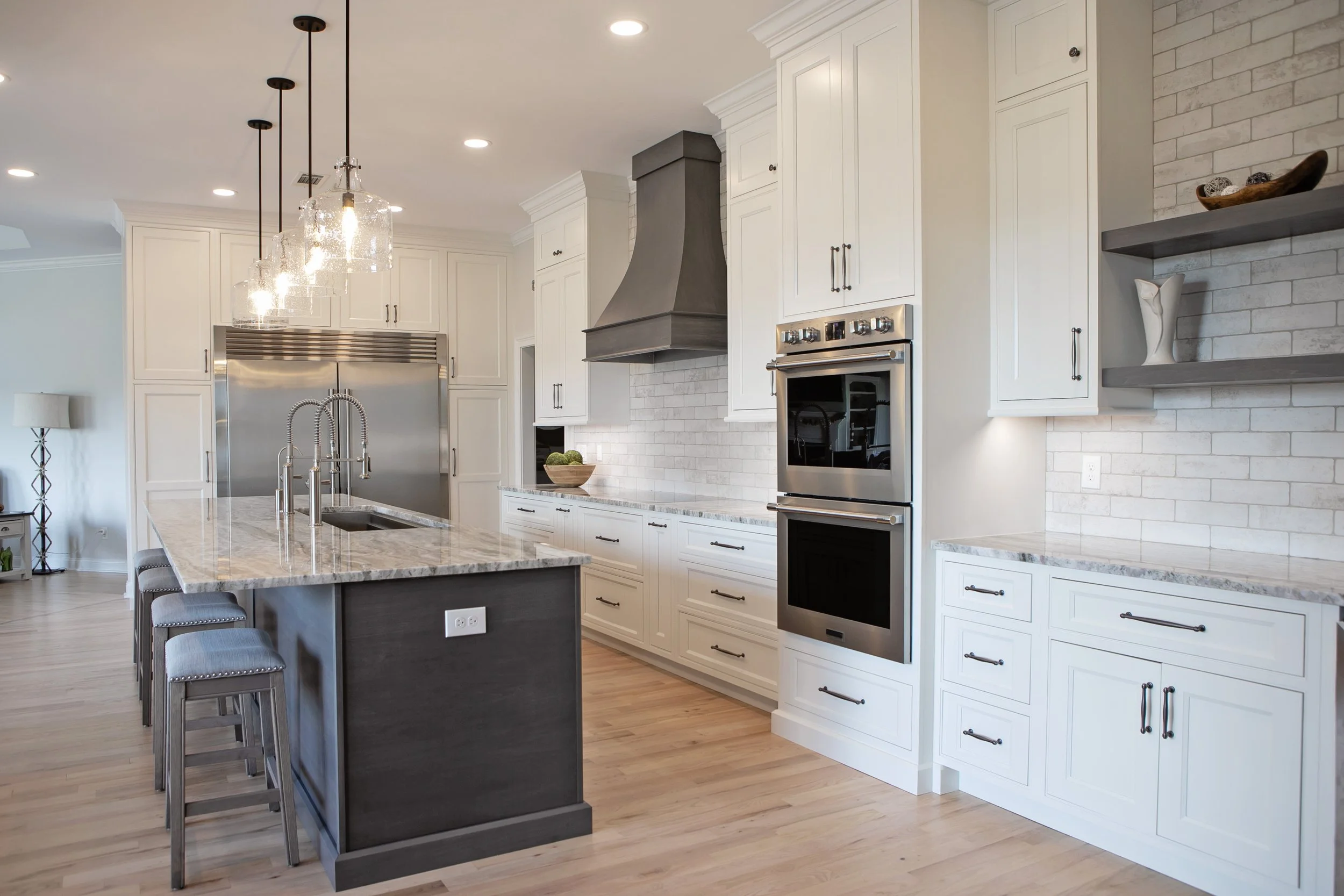 Walls were removed to create an open-concept kitchen, improving flow and connecting the space seamlessly to the dining and living areas.